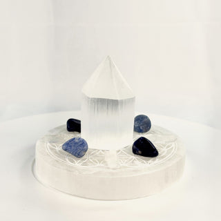 Mini Crystal Grid Set for Clarity, side view, selenite tower centered on the Flower of Life plate with sodalite, blue aventurine and Lemurian quartz points
