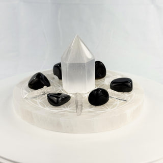 Crystal Grid Set for Protection, side view, selenite tower centered on the Flower of Life plate with gold sheen obsidian, shungite and Lemurian quartz points