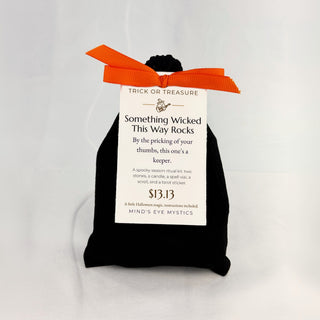 Trick or Treasure: Something Wicked This Way Rocks mystery bag with its theme tag